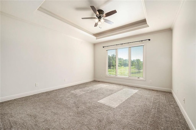 4301 N 141st St, Basehor, KS 66007 - empty room featuring a raised ceiling, ornamental molding, carpet floors, and ceiling fan