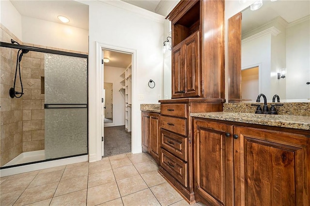 4301 N 141st St, Basehor, KS 66007 - bathroom with ornamental molding, vanity, a stall shower, and tile patterned floors