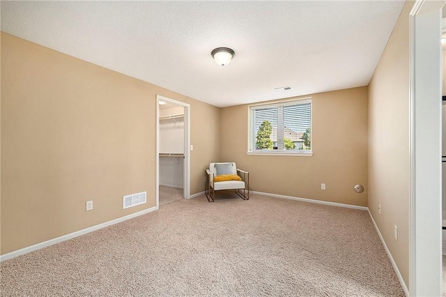 4301 N 141st St, Basehor, KS 66007 - sitting room featuring carpet flooring and a textured ceiling