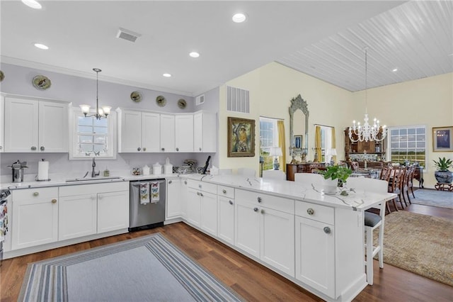 kitchen featuring stainless steel dishwasher, a chandelier, a sink, a peninsula, and recessed lighting