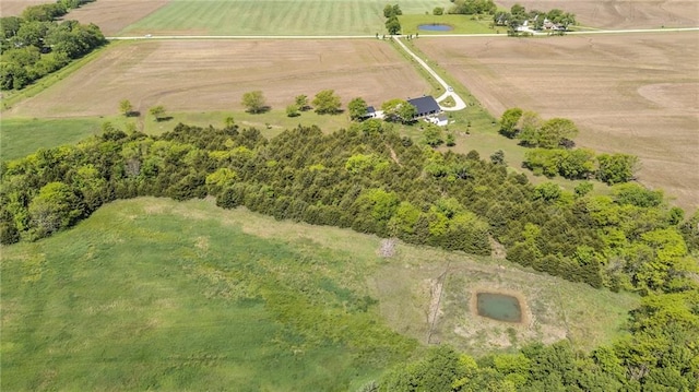 aerial overview of property's location featuring rural landscape and rows of crops