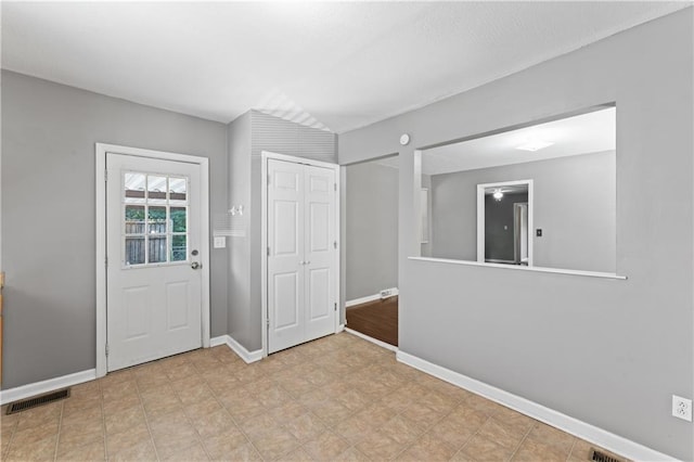 foyer entrance with baseboards