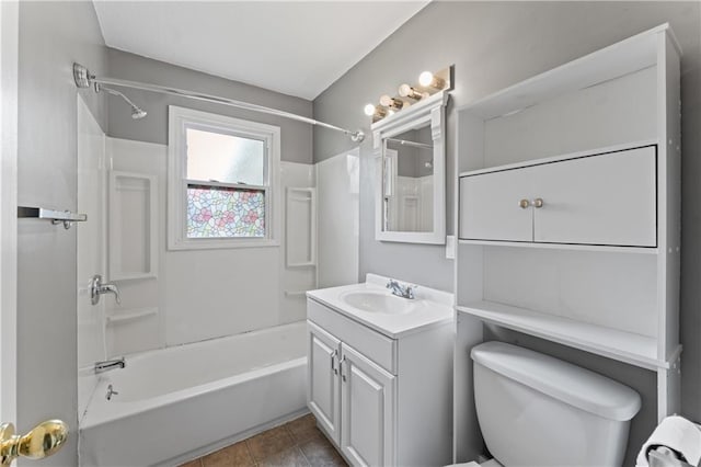 bathroom featuring shower / washtub combination, toilet, and vanity