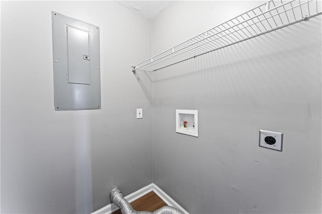 washroom with electric dryer hookup, electric panel, washer hookup, and baseboards