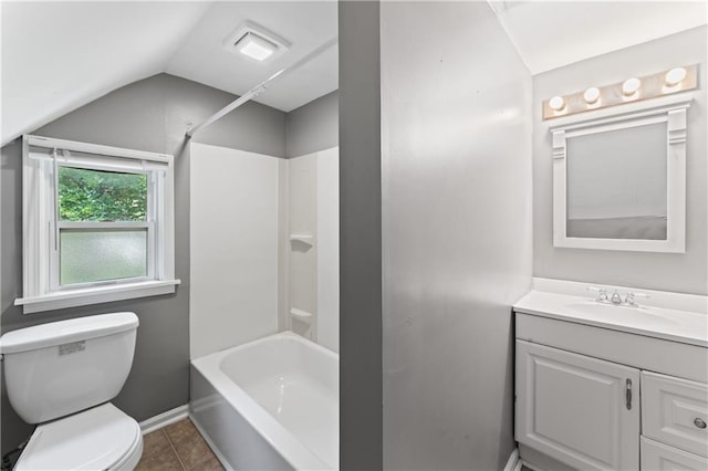 full bath with vaulted ceiling, toilet, vanity, shower / tub combination, and tile patterned flooring