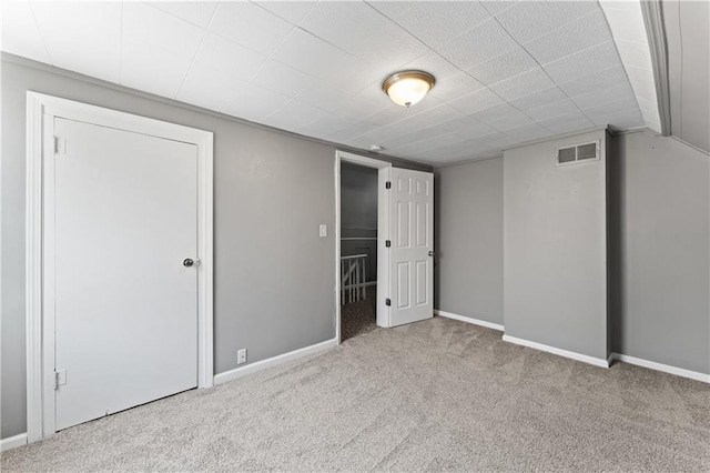 unfurnished bedroom with carpet and baseboards