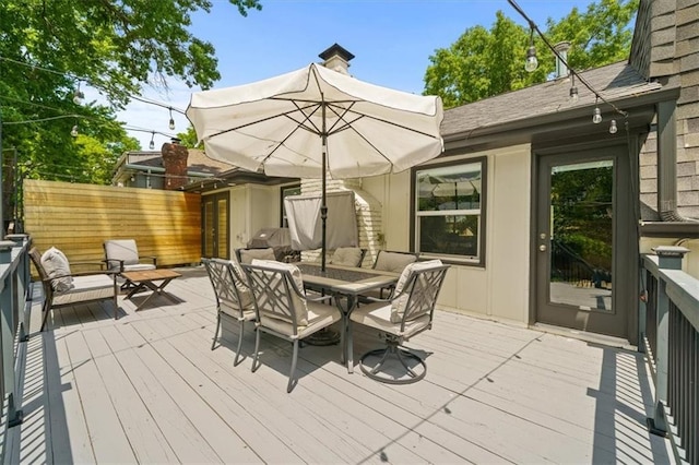 10319 W 92nd Pl, Overland Park, KS 66214 - wooden terrace with outdoor dining space