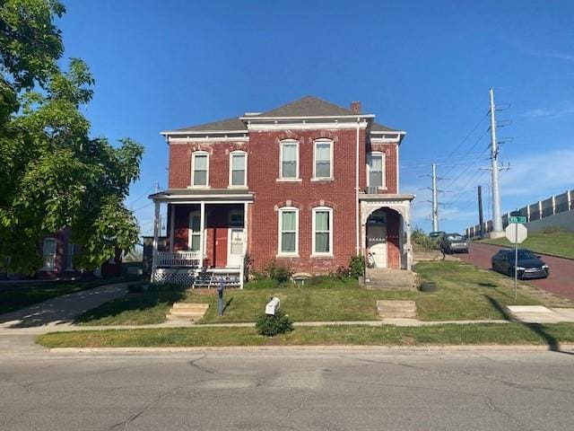 432 S 5th St, Atchison, KS 66002 - italianate home with a front lawn and brick siding