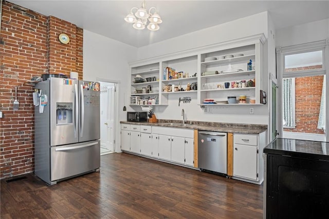 432 S 5th St, Atchison, KS 66002 - kitchen featuring appliances with stainless steel finishes, open shelves, dark wood-style floors, a chandelier, and white cabinetry