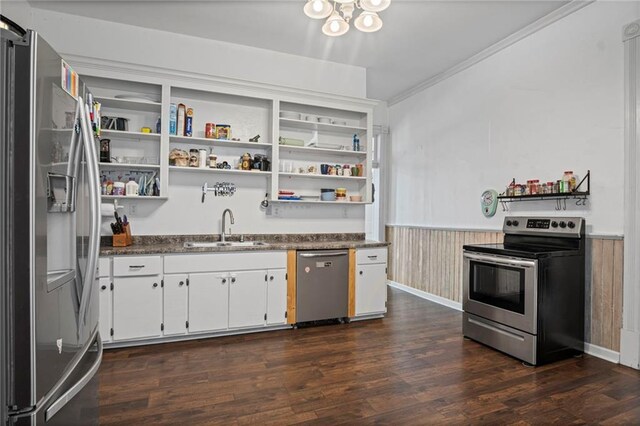 432 S 5th St, Atchison, KS 66002 - kitchen with appliances with stainless steel finishes, wainscoting, dark countertops, open shelves, and dark wood finished floors