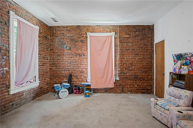 432 S 5th St, Atchison, KS 66002 - unfurnished living room with brick wall and carpet