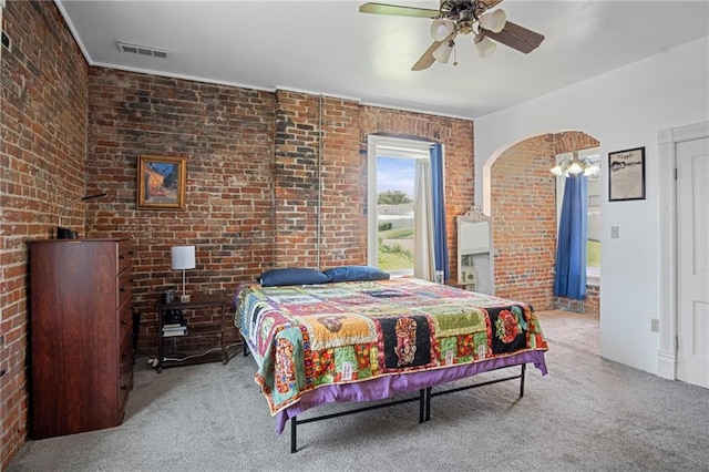 432 S 5th St, Atchison, KS 66002 - carpeted bedroom featuring brick wall and a ceiling fan