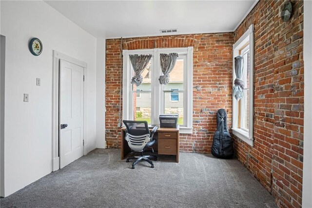 432 S 5th St, Atchison, KS 66002 - carpeted home office featuring plenty of natural light and brick wall