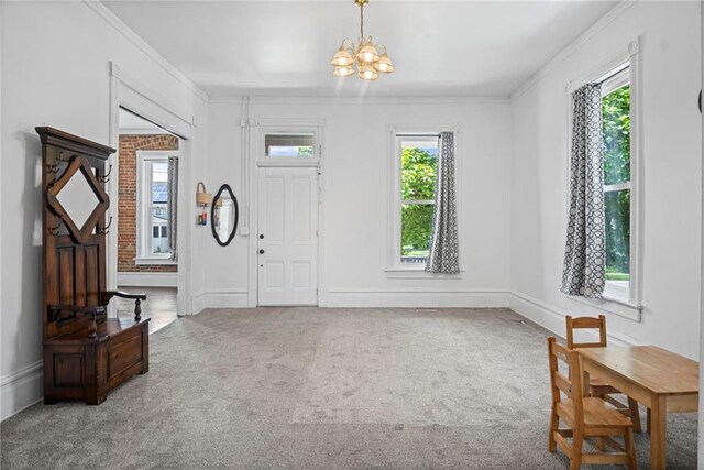 432 S 5th St, Atchison, KS 66002 - entrance foyer with a chandelier, ornamental molding, and carpet