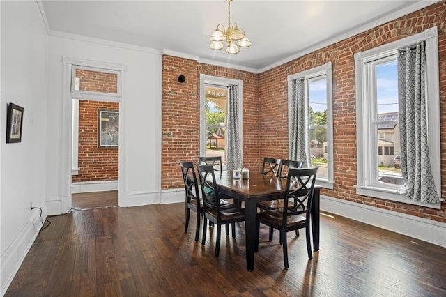 432 S 5th St, Atchison, KS 66002 - dining room featuring a chandelier, wood-type flooring, brick wall, and ornamental molding