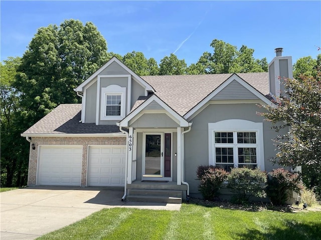6503 NW Sioux Ct, Parkville, MO 64152 - view of front of house with driveway, a front yard, a garage, and a shingled roof