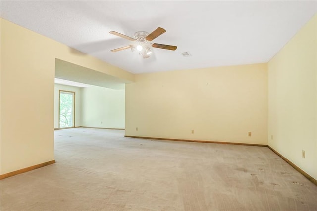 6503 NW Sioux Ct, Parkville, MO 64152 - spare room with ceiling fan, light carpet, and baseboards