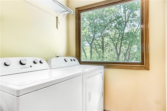 6503 NW Sioux Ct, Parkville, MO 64152 - laundry area with washer and dryer and healthy amount of natural light