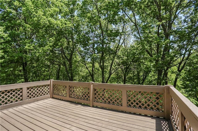 6503 NW Sioux Ct, Parkville, MO 64152 - wooden deck featuring view of wooded area