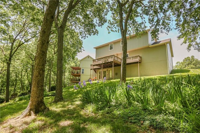 6503 NW Sioux Ct, Parkville, MO 64152 - rear view of property featuring a deck