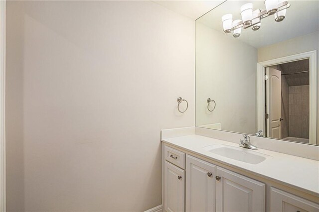 bathroom featuring vanity and baseboards