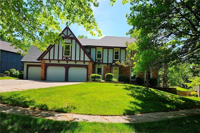 5806 N Kensington Ave, Kansas City, MO 64119 - tudor house featuring a front lawn, driveway, a garage, and a shingled roof
