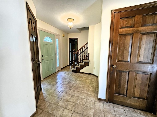 5806 N Kensington Ave, Kansas City, MO 64119 - entryway with baseboards and stairs