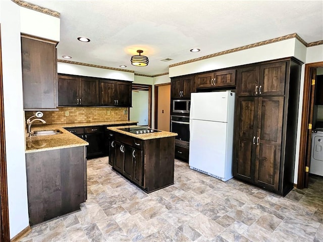 5806 N Kensington Ave, Kansas City, MO 64119 - kitchen featuring freestanding refrigerator, wall oven, stainless steel microwave, a sink, and black electric stovetop