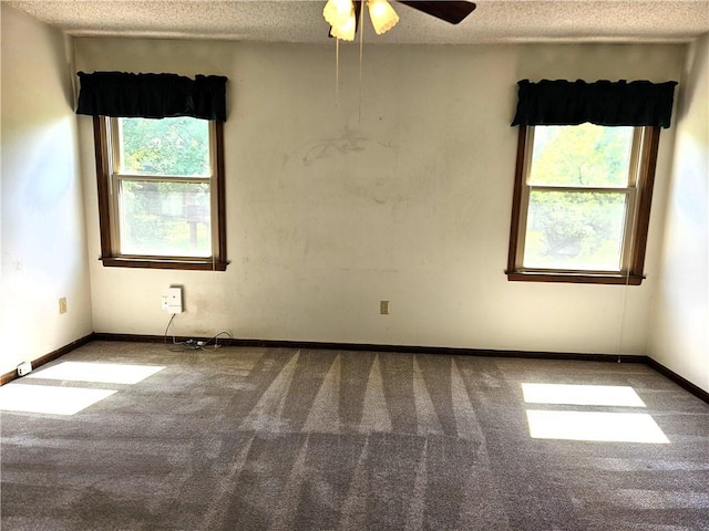 5806 N Kensington Ave, Kansas City, MO 64119 - unfurnished room with carpet floors, a textured ceiling, ceiling fan, and baseboards