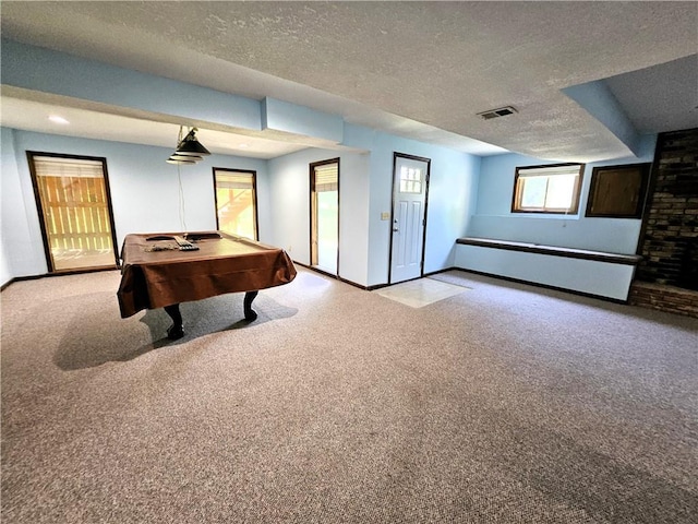 5806 N Kensington Ave, Kansas City, MO 64119 - playroom with a textured ceiling, carpet floors, billiards, and baseboards