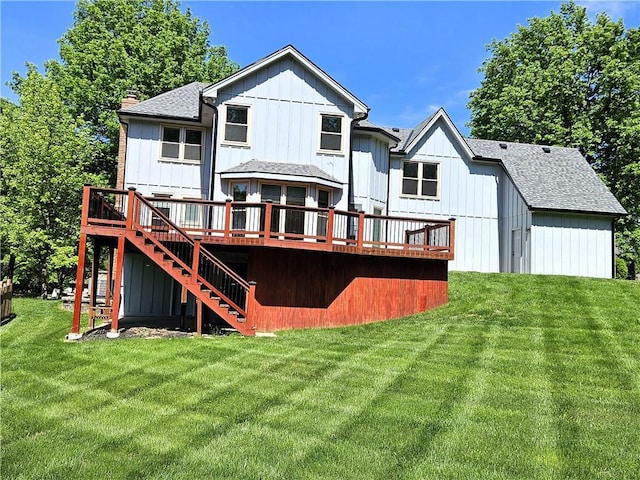 5806 N Kensington Ave, Kansas City, MO 64119 - rear view of property featuring stairs, a wooden deck, a lawn, a shingled roof, and a chimney