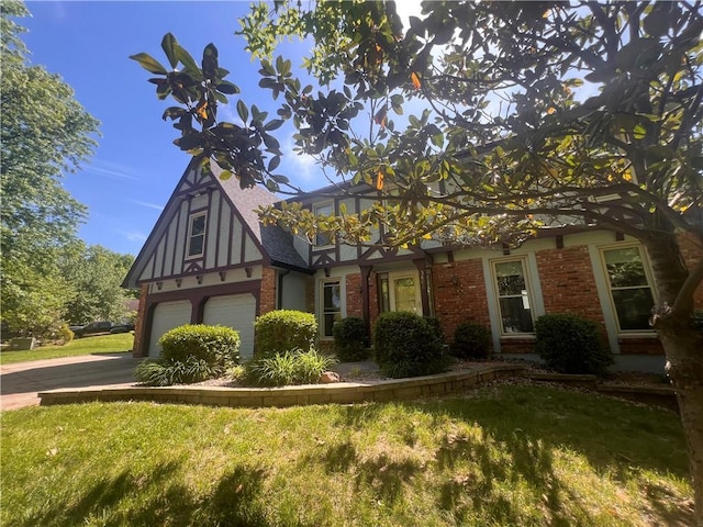 5806 N Kensington Ave, Kansas City, MO 64119 - tudor house featuring brick siding, an attached garage, a front lawn, and concrete driveway