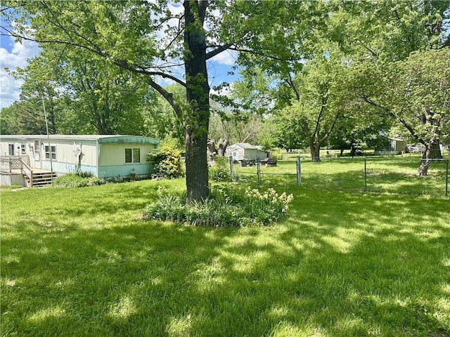 view of yard with a deck and view of scattered trees