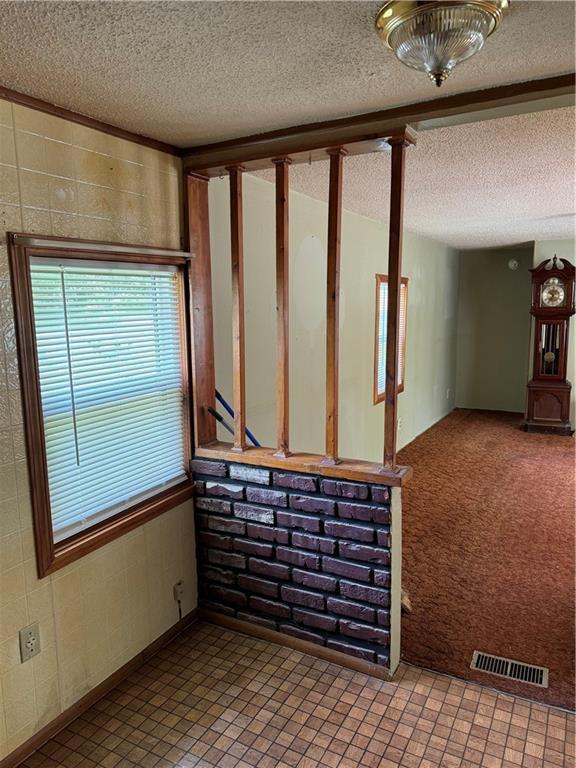 32572 Magnolia Ln, Excelsior Springs, MO 64024 - unfurnished room featuring a textured ceiling