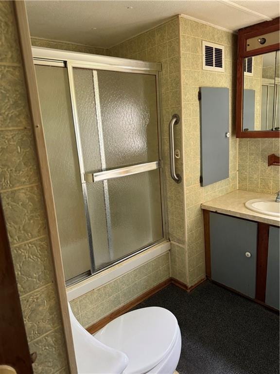 32572 Magnolia Ln, Excelsior Springs, MO 64024 - full bath featuring tile walls, vanity, an enclosed shower, and toilet
