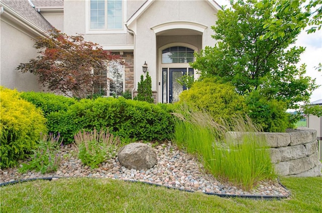 1110 Metfield Ln, Raymore, MO 64083 - entrance to property featuring stucco siding and stone siding