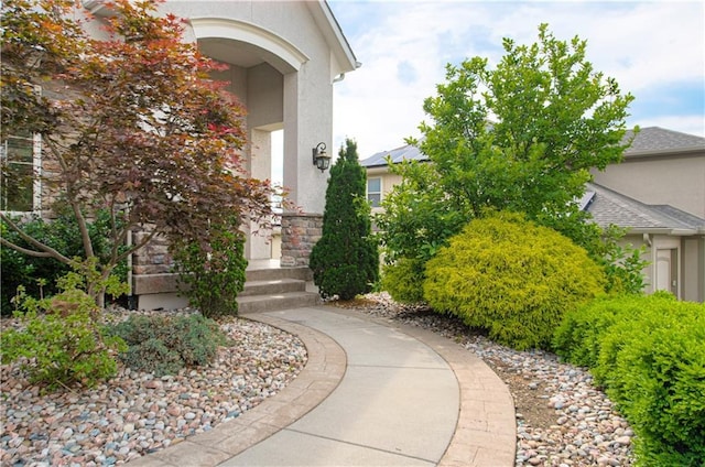 1110 Metfield Ln, Raymore, MO 64083 - view of exterior entry with stucco siding