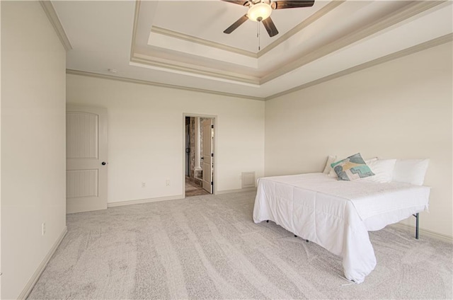 1110 Metfield Ln, Raymore, MO 64083 - bedroom with ornamental molding, a raised ceiling, carpet flooring, baseboards, and ceiling fan