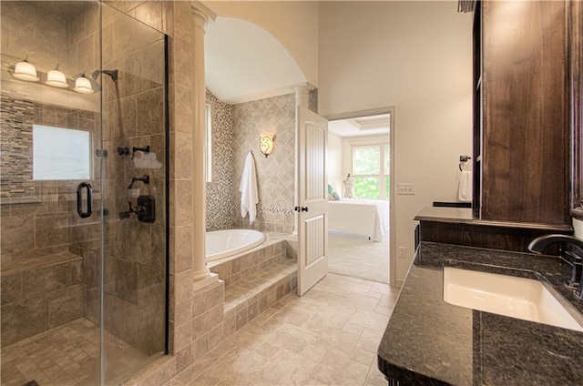 1110 Metfield Ln, Raymore, MO 64083 - full bath with double vanity, a garden tub, a stall shower, and stone finish flooring