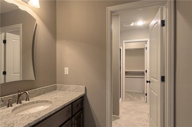 1110 Metfield Ln, Raymore, MO 64083 - bathroom featuring vanity and baseboards