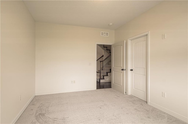1110 Metfield Ln, Raymore, MO 64083 - unfurnished bedroom featuring carpet, baseboards, and a closet