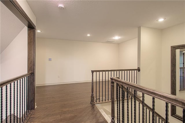 1110 Metfield Ln, Raymore, MO 64083 - corridor with an upstairs landing, wood finished floors, recessed lighting, and baseboards