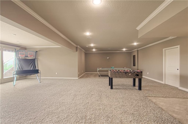 1110 Metfield Ln, Raymore, MO 64083 - recreation room featuring crown molding, carpet flooring, baseboards, recessed lighting, and a textured ceiling