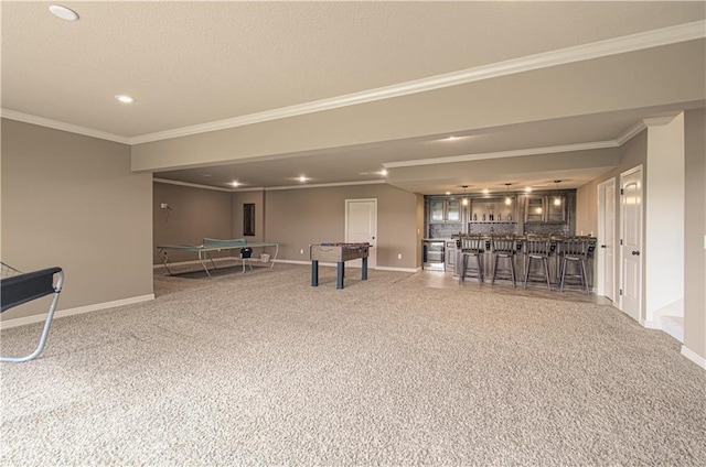 1110 Metfield Ln, Raymore, MO 64083 - playroom with wet bar, ornamental molding, baseboards, carpet flooring, and recessed lighting