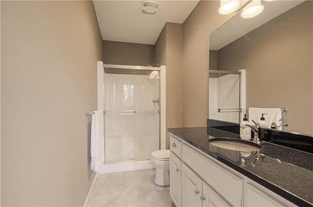 1110 Metfield Ln, Raymore, MO 64083 - bathroom featuring a shower stall, vanity, toilet, tile patterned floors, and baseboards