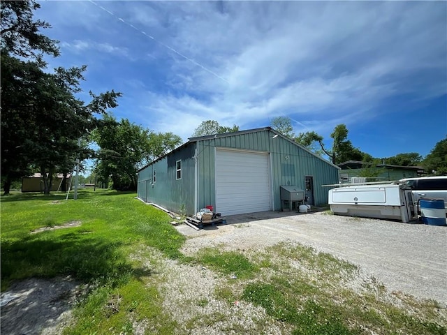 view of outbuilding with an outdoor structure and dirt driveway