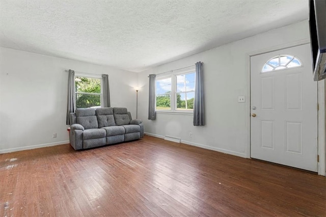 9021 E 79th St, Raytown, MO 64138 - entryway with wood finished floors and a textured ceiling