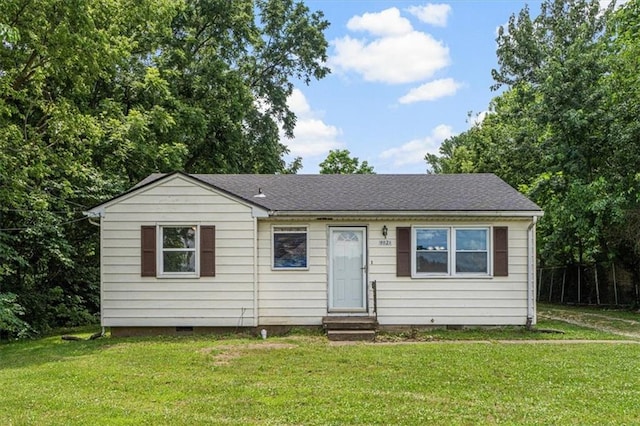 9021 E 79th St, Raytown, MO 64138 - view of front facade with entry steps, crawl space, a front lawn, and a shingled roof