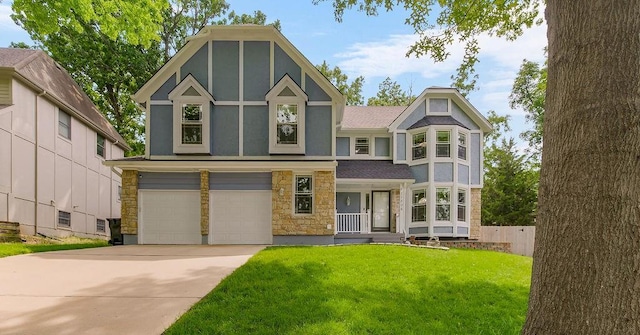 11506 Knox St, Overland Park, KS 66210 - tudor house with stone siding, an attached garage, concrete driveway, a front lawn, and stucco siding