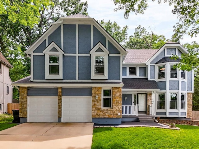 11506 Knox St, Overland Park, KS 66210 - tudor house with stone siding, a garage, stucco siding, and driveway